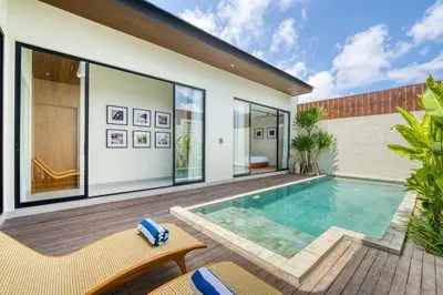 a swimming pool in the backyard of a house at Tropical 3BR Villa 2 Private Pools in Jimbaran in Jimbaran