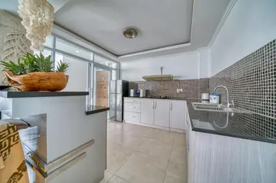 a kitchen with a sink and a counter top at Rumah Bella Private Villa 3 Bedroom 3 Bathroom in Jimbaran