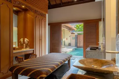 a dining room with a table and a sink at Villa Elegant by Exotiq in Seminyak