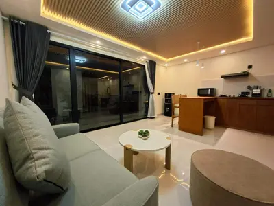 a living room with a couch and a table at Seminyak Apartment 37 in Seminyak