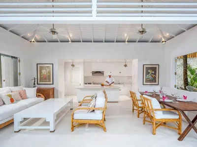 a living room with a couch and a table at Villa Lulito in Seminyak