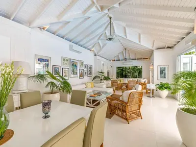 a living room with a table and chairs at Villa Lulito in Seminyak