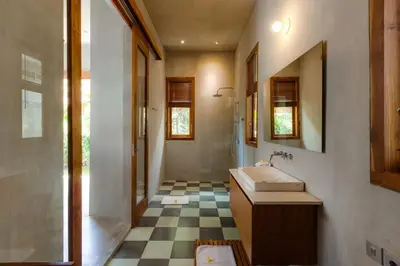 a bathroom with a sink and a shower at ZIN Berawa Villas & Bungalows in Canggu