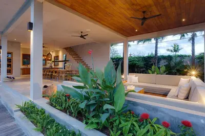 an outdoor living area of a villa with a couch at ZIN Berawa Villas & Bungalows in Canggu