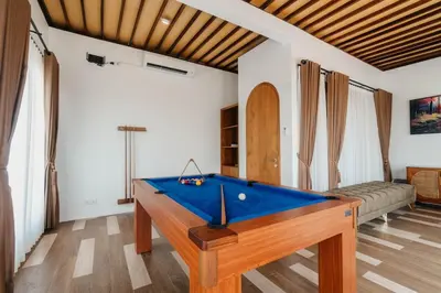 a pool table in the middle of a living room at Villa Bens Luxury - 3BR Villa in Kerobokan in Kerobokan