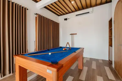 a pool table in the middle of a room at Villa Bens Luxury - 3BR Villa in Kerobokan in Kerobokan