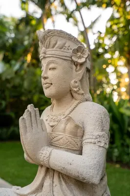 a statue of a woman standing with her hands at 4-Bedroom Villa - Large swimming pool - Ideal place for friends and families in Seminyak