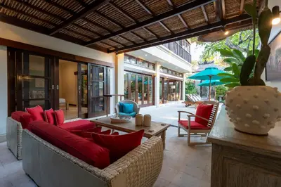 a living room with a couch and red pillows at 4-Bedroom Villa - Large swimming pool - Ideal place for friends and families in Seminyak