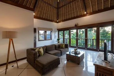 a living room with a couch and a table at 4-Bedroom Villa - Large swimming pool - Ideal place for friends and families in Seminyak