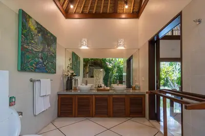 a bathroom with two sinks and a large mirror at 4-Bedroom Villa - Large swimming pool - Ideal place for friends and families in Seminyak