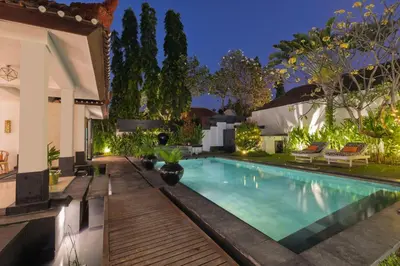 a swimming pool in the backyard of a house at Ocean Two 3BR Private Pool in Oberoi Seminyak in Seminyak