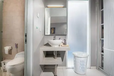 a bathroom with a sink and a toilet at Villa Goodison - Two Bedrooms in Legian