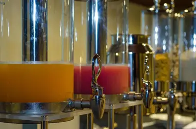 a group of machines with different types of drinks at Savvoya Hotel Seminyak in Seminyak