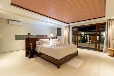 a bedroom with a large bed in a room at JB Hazel, 4Bedroom villa in Jimbaran in Jimbaran