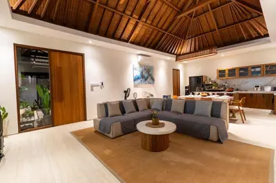 a living room with a couch and a table at JB Hazel, 4Bedroom villa in Jimbaran in Jimbaran