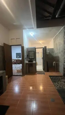 a living room with a wooden floor and a television at 2 Bedrooms Private Pool Villa Indi K Kerobokan in Seminyak
