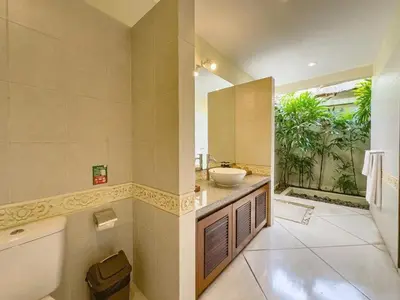 a bathroom with a sink and a large window at Luxury 4BR - Villa Santai - Central Seminyak in Seminyak