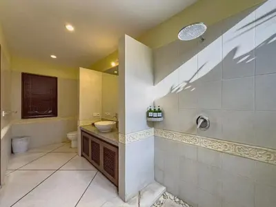a bathroom with a sink and a toilet and a shower at Luxury 4BR - Villa Santai - Central Seminyak in Seminyak