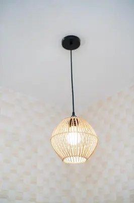 a light hanging from a ceiling in a room at Prime Location Seminyak 3BR Pool Villa in Seminyak
