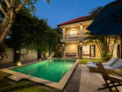 a swimming pool in the backyard of a house at Villa Cometa Prime Seminyak by Adam Jyota Management in Seminyak