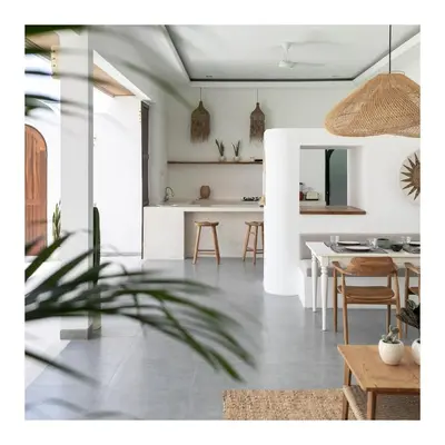 a living room and kitchen with a table and chairs at Villa Jiji cozy chic in Bali - just renovated ! in Canggu