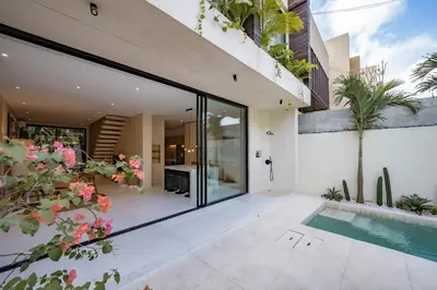 an internal view of a house with a swimming pool at Villa Nazare Berawa in Canggu