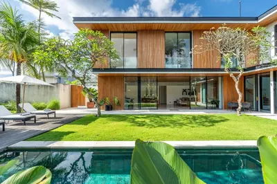 a house with a pool in front of it at Villa Semilir Sendja, Canggu in Canggu