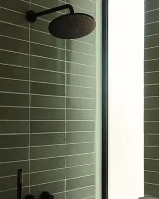 a shower with a ceiling fan in a bathroom at Villa Semilir Sendja, Canggu in Canggu