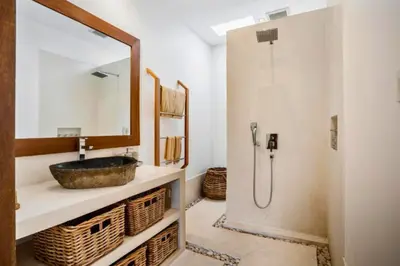 a bathroom with a sink and a shower at Feodora Peaceful 4 BR Private Pool Villa in Seminyak