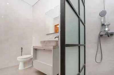 a bathroom with a sink and a toilet at Villa Kartini - Two Bedrooms in Legian