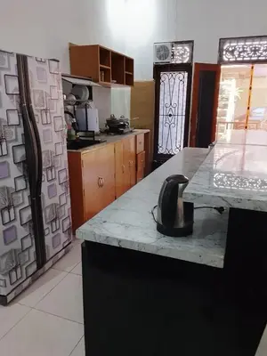 a kitchen with a sink and a counter top at Kuta Grace house Bali in Kuta