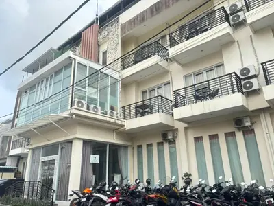 a group of motorcycles parked in front of a building at Ultimate Residence in Seminyak