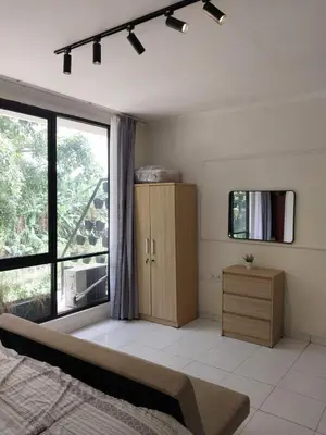 a bedroom with a bed and a large window at Villa 2 Kavi Minimalis 1 Kamar Di Sanur in Sanur