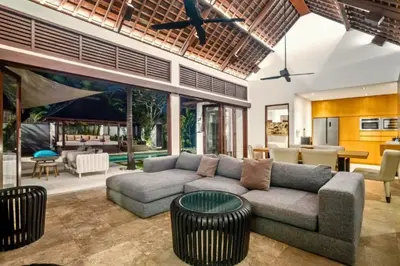 a living room with a couch and a table at Monique 3 BR Private Pool Villa in Seminyak