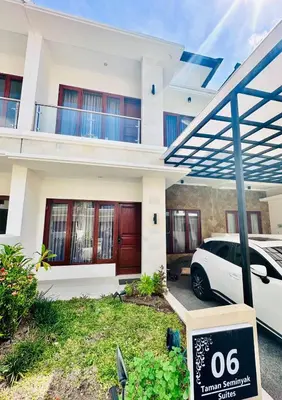 a white car parked in front of a house at Casa Danasa, secure and serene Villa at the heart of Seminyak with 24hr One Gate Security in Seminyak