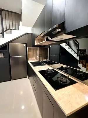 a kitchen with a stove and a counter top at Casa Danasa, secure and serene Villa at the heart of Seminyak with 24hr One Gate Security in Seminyak