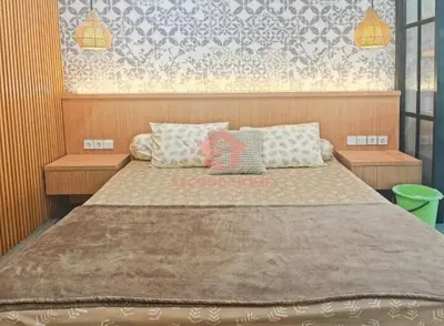 a bedroom with a large bed with pillows on it at Newly Lavaya Resort 1BR with pool in Nusa Dua
