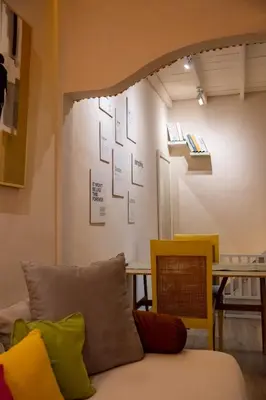 a living room with a couch and a table at Palm Villa 4 , Seminyak Center in Seminyak