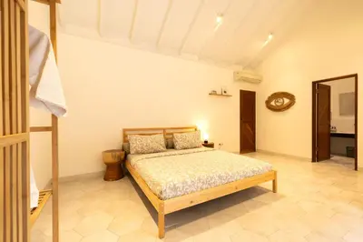 a bedroom with a bed in a room at Charming Two Bedroom Villa Near Seminyak Beach in Seminyak