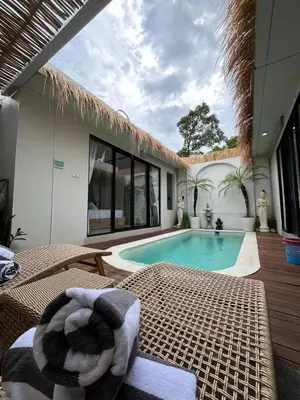 a swimming pool in the middle of a house at Ametys 1 Villa - Cozy 2BR Villa with Private Pool & Prime Seminyak in Seminyak