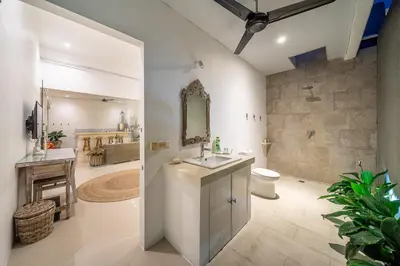 a bathroom with a sink and a toilet at Villa GR888 - 3BR Tropical Comfort Seminyak in Seminyak