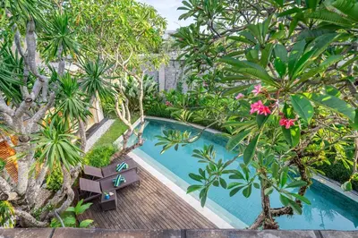 an overhead view of a swimming pool in a garden at Lux Ayuni Big Modern 2BR Designer Villa Berawa in Canggu