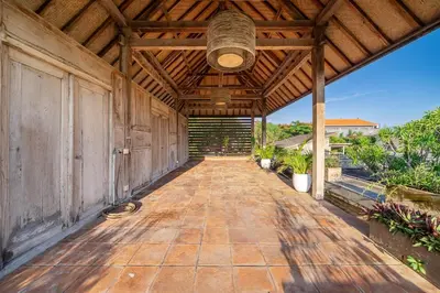 an empty porch of a house with a wooden ceiling at Lux Ayuni Big Modern 2BR Designer Villa Berawa in Canggu