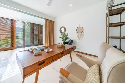 a living room with a couch and a table at Lux Ayuni Big Modern 2BR Designer Villa Berawa in Canggu