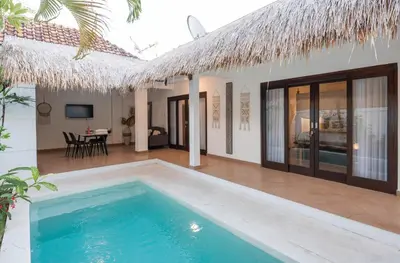 a swimming pool in front of a villa at 2BR Villa - Central Seminyak - Private Cook & Breakfast in Seminyak