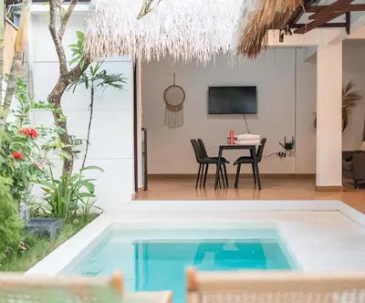 a villa with a swimming pool and a dining room at 2BR Villa - Central Seminyak - Private Cook & Breakfast in Seminyak