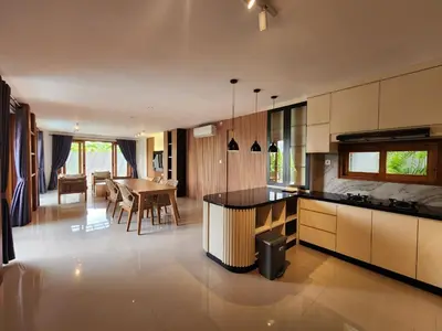 a kitchen with a table and a dining room at Best Villa in Jimbaran