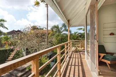 a view from the balcony of a house at Villa Anicca - Family-Friendly 4BR Villa Umalas With Private Pool And Rooftop Lounge in Canggu