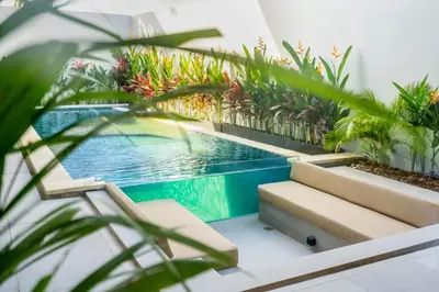 a swimming pool in a house with plants at New Villa 3BR Umalas Pool Near Seminyak and Canggu in Canggu