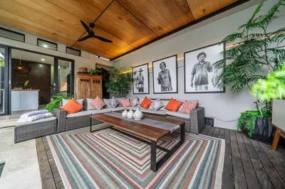 a living room with a couch and a coffee table at Villa 121 - Modern 1BR Villa Near Batu Belig Beach in Seminyak
